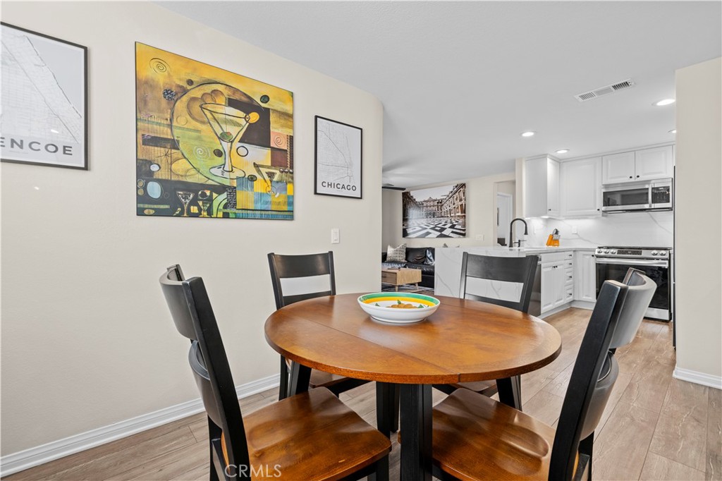 28454 Santa Rosa Lane Saugus, CA 91350 - Photo 6 of 36 a view of a dining room with furniture and wooden floor
