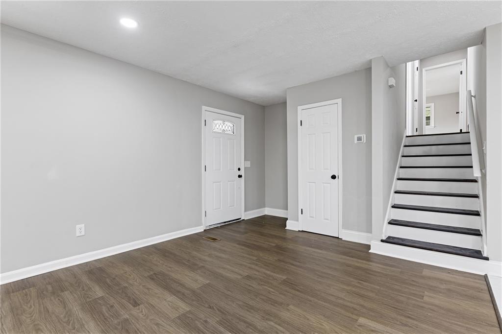 353 Old Rosser Road Stone Mountain, GA 30087 - Photo 19 of 46 wooden floor in an empty room
