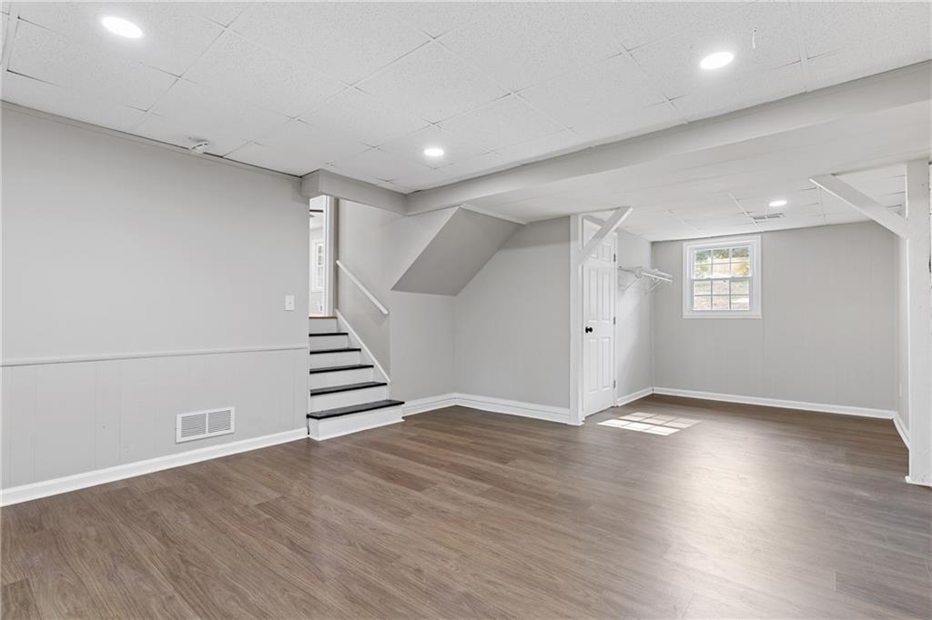 353 Old Rosser Road Stone Mountain, GA 30087 - Photo 27 of 46 an empty room with wooden floor