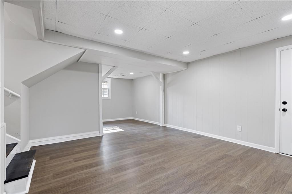 353 Old Rosser Road Stone Mountain, GA 30087 - Photo 29 of 46 a view of an empty room with wooden floor