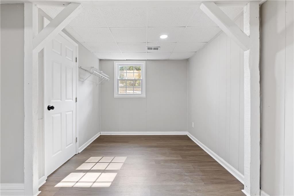 353 Old Rosser Road Stone Mountain, GA 30087 - Photo 30 of 46 a view of an empty room with a window