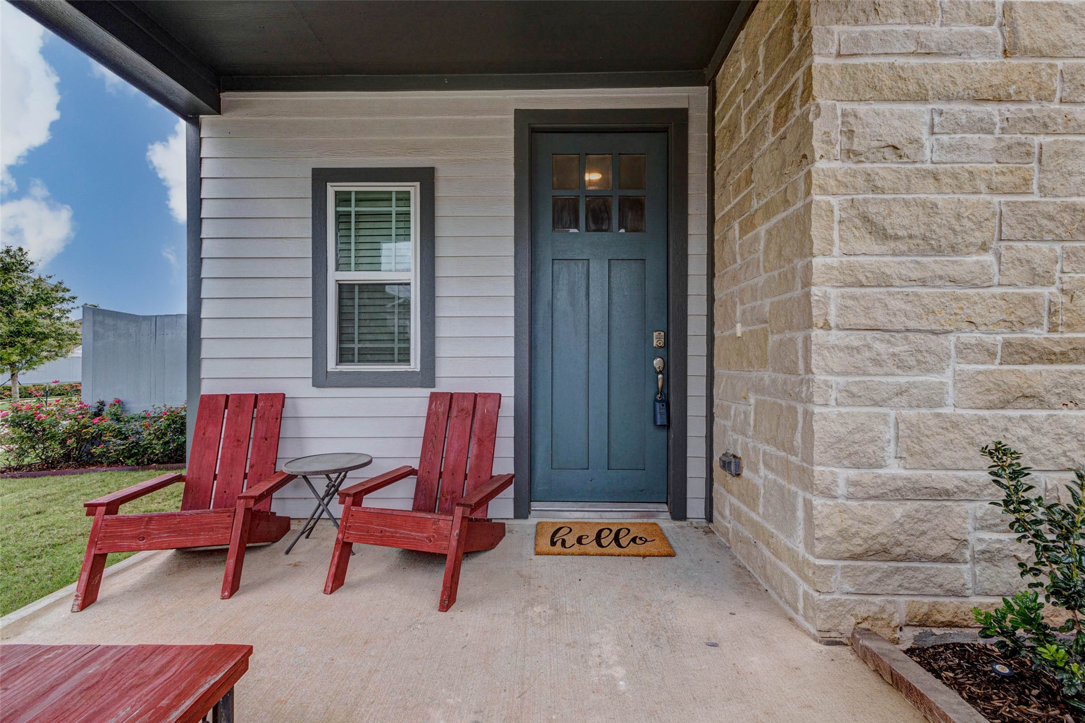 32418 Fly Fish Way Fulshear, TX 77441 - Photo 4 of 40 The covered front porch is a welcoming retreat, framed by beautiful stone accents and a bold front door that sets the tone for the warmth found throughout the home. There is plenty of space to sit, relax, and enjoy your morning coffee before stepping inside.