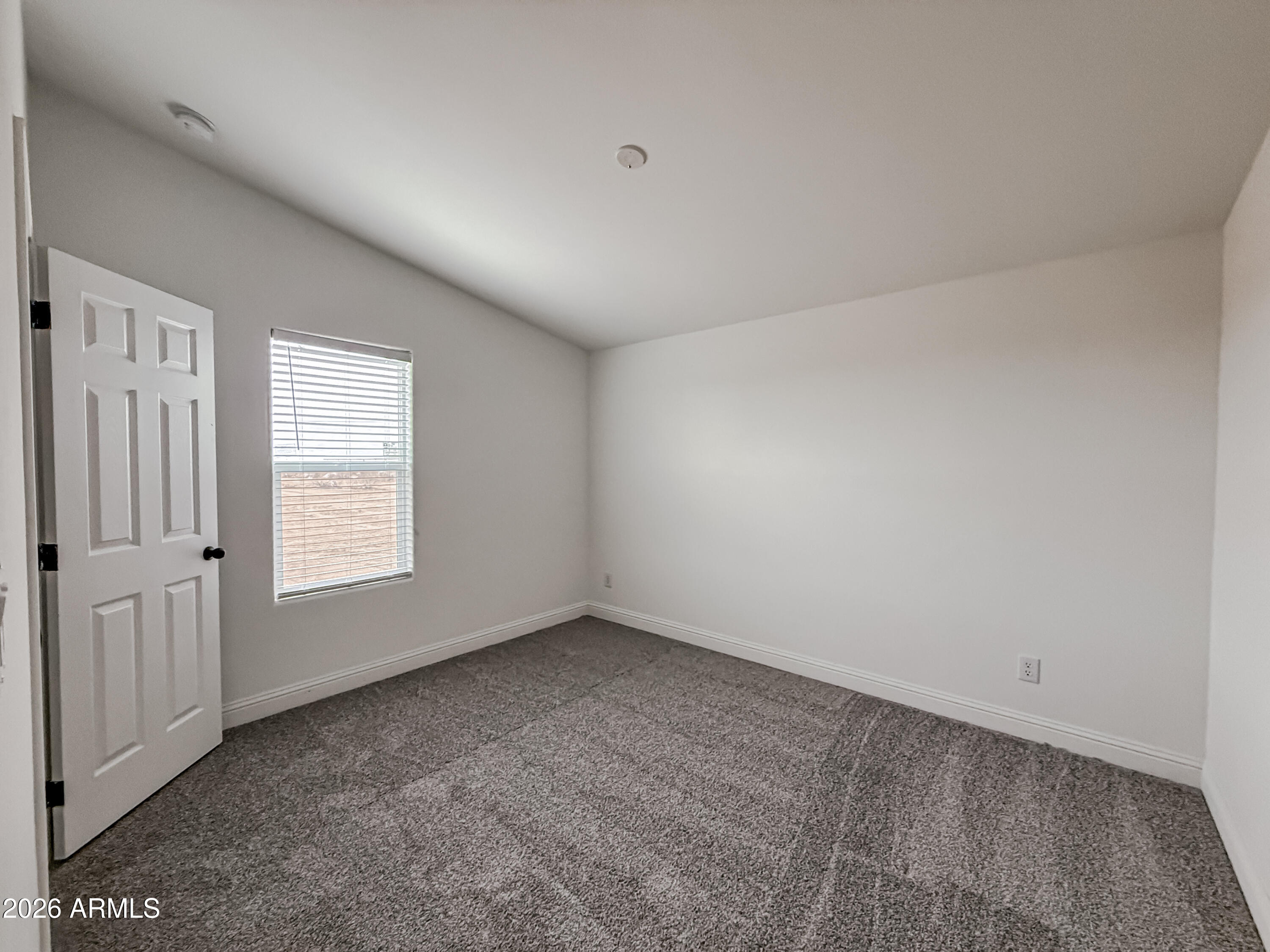 22775 East Day Spring Lane Florence, AZ 85132 - Photo 11 of 16 an empty room with a window