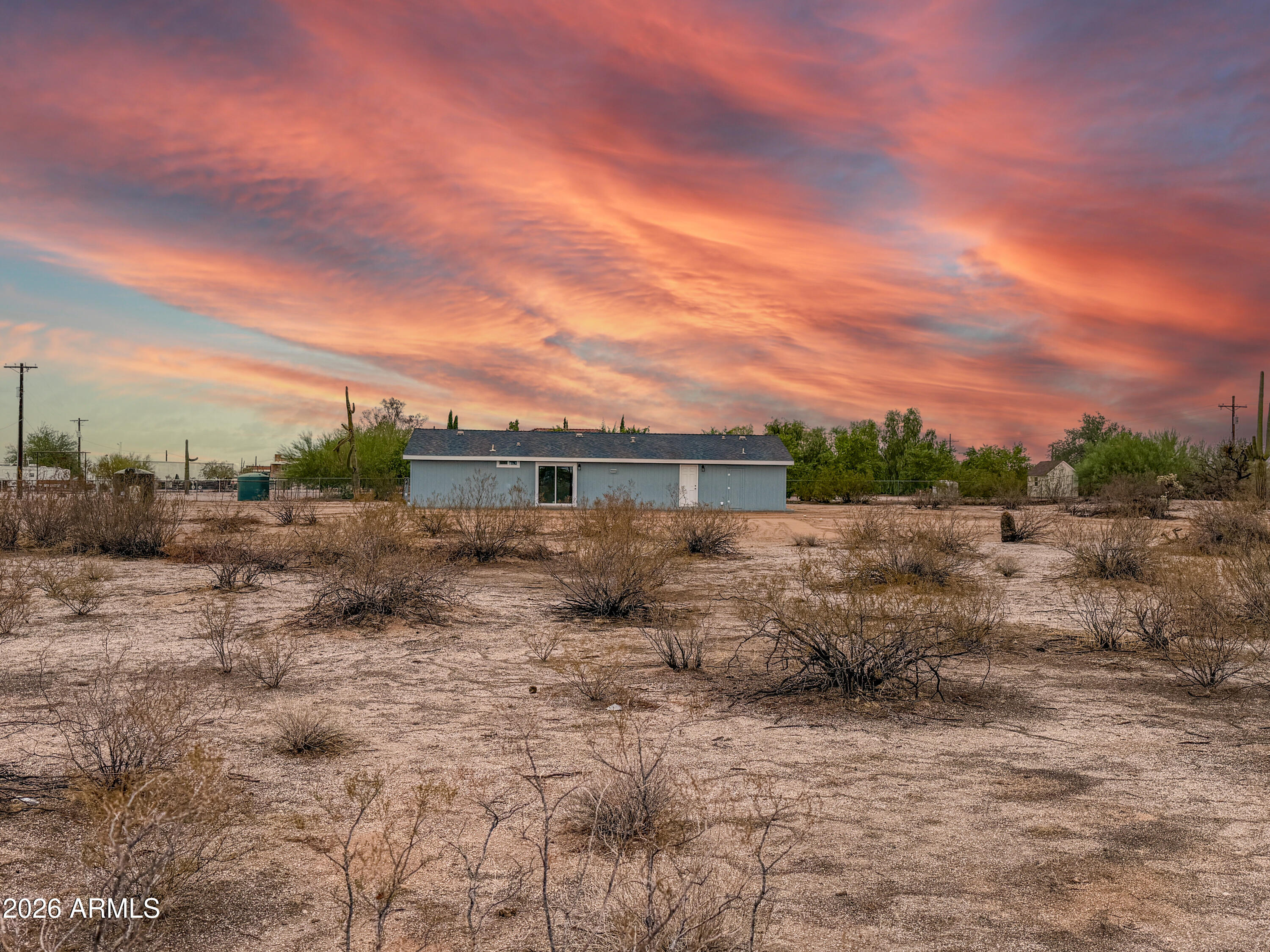 22775 East Day Spring Lane Florence, AZ 85132 - Photo 13 of 16 a view of a dry yard with wooden fence