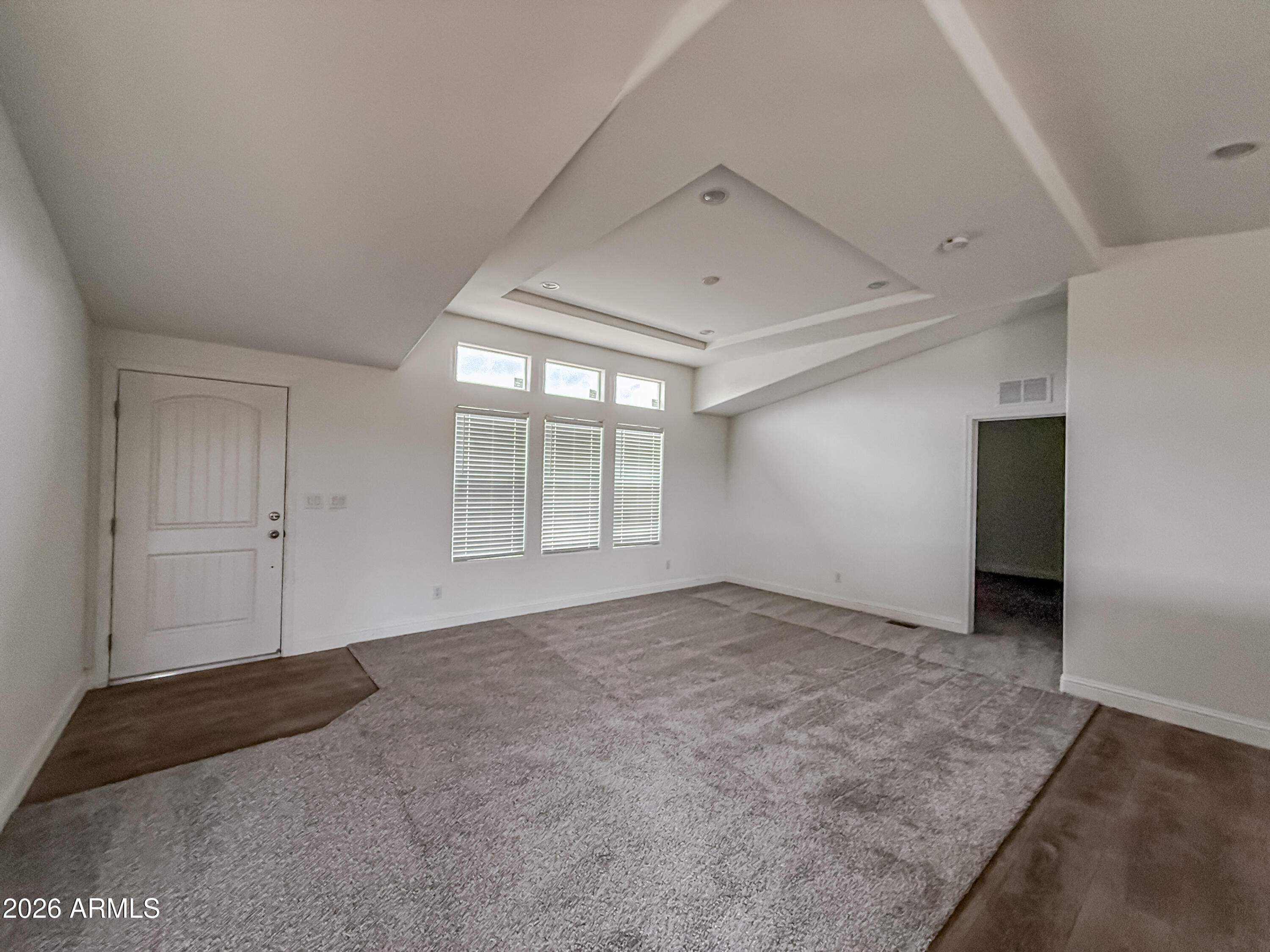 22775 East Day Spring Lane Florence, AZ 85132 - Photo 4 of 16 an empty room with windows