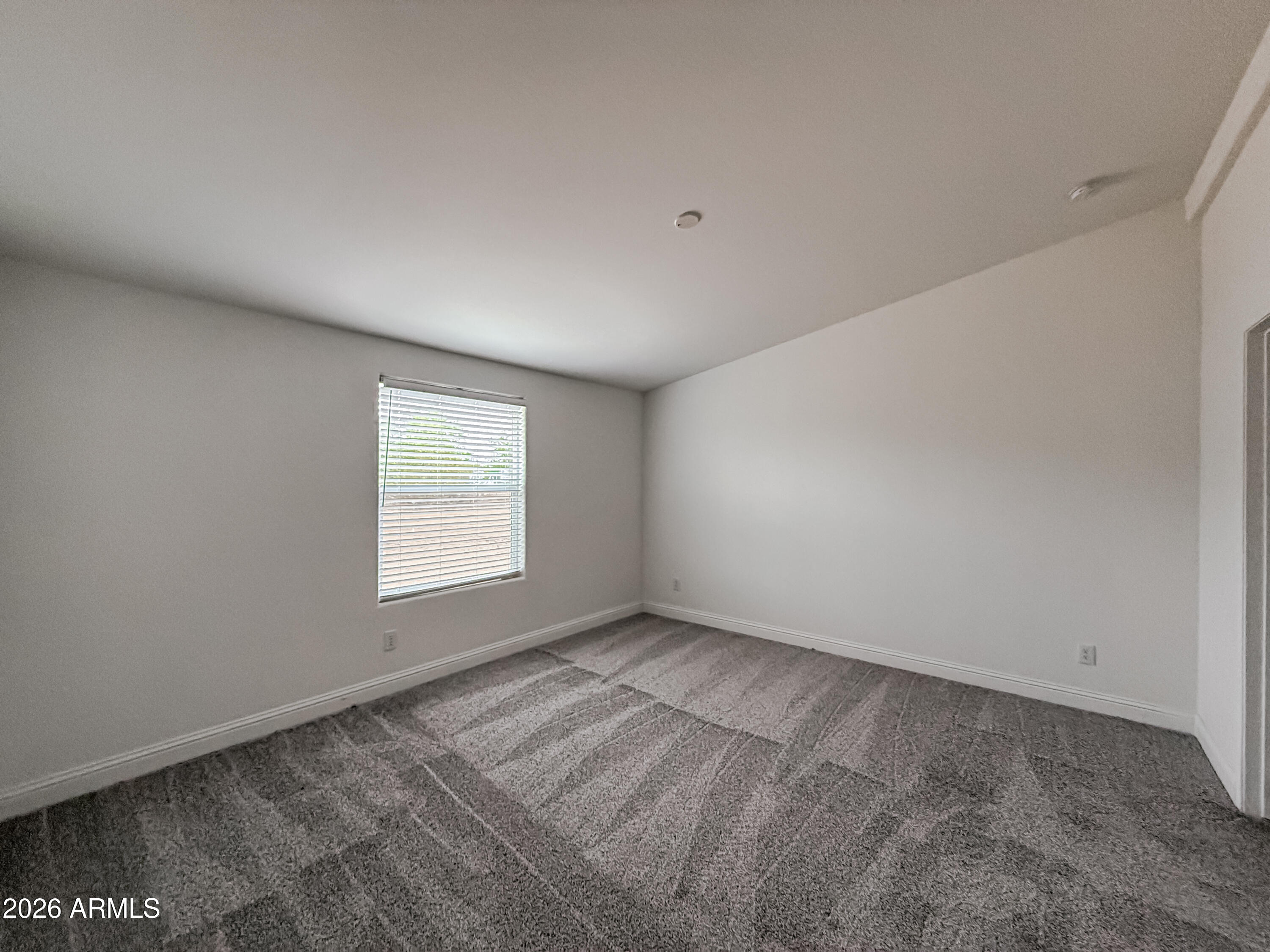 22775 East Day Spring Lane Florence, AZ 85132 - Photo 8 of 16 an empty room with a window