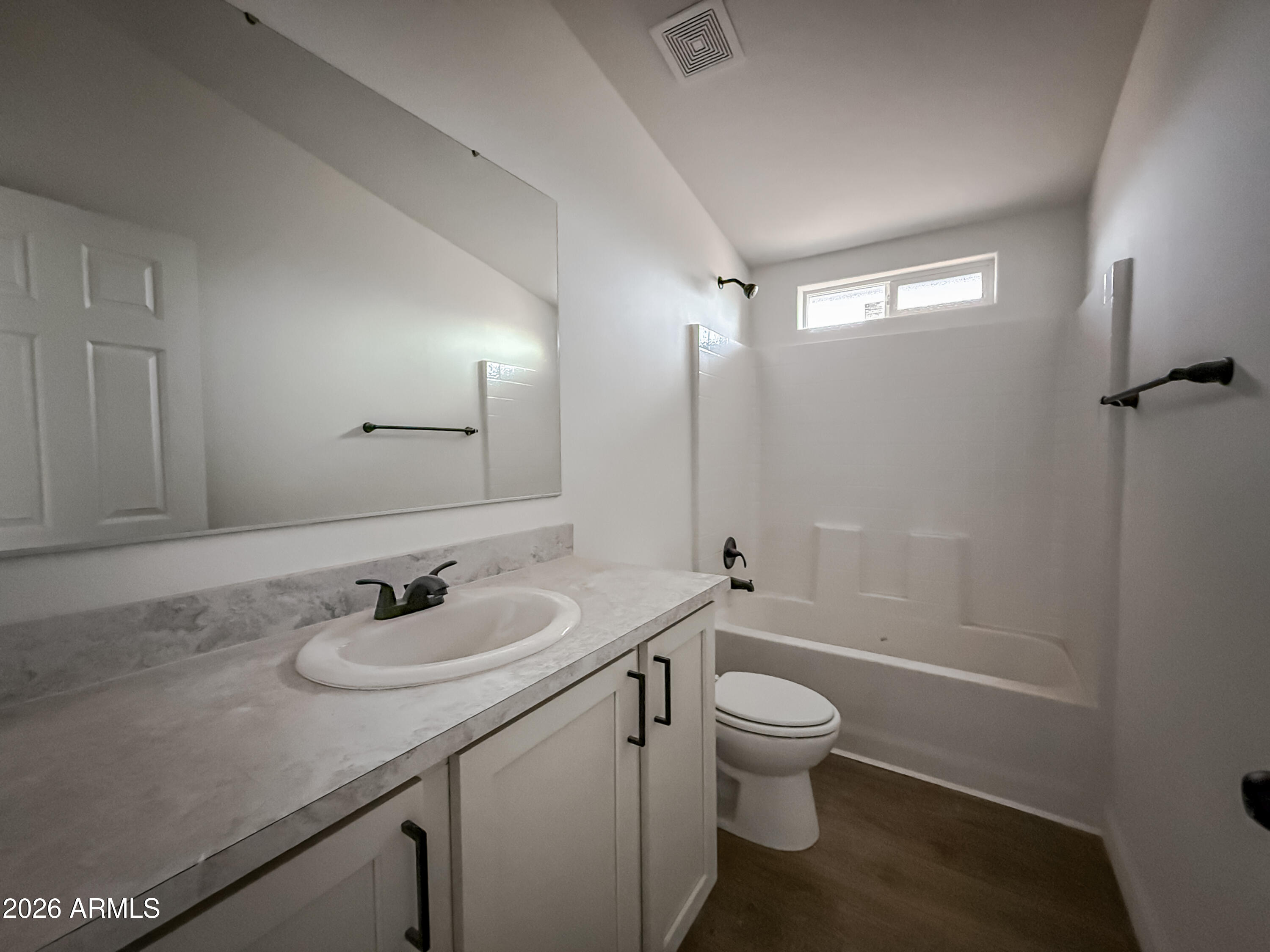 22775 East Day Spring Lane Florence, AZ 85132 - Photo 10 of 16 a bathroom with a granite countertop sink toilet a mirror and shower