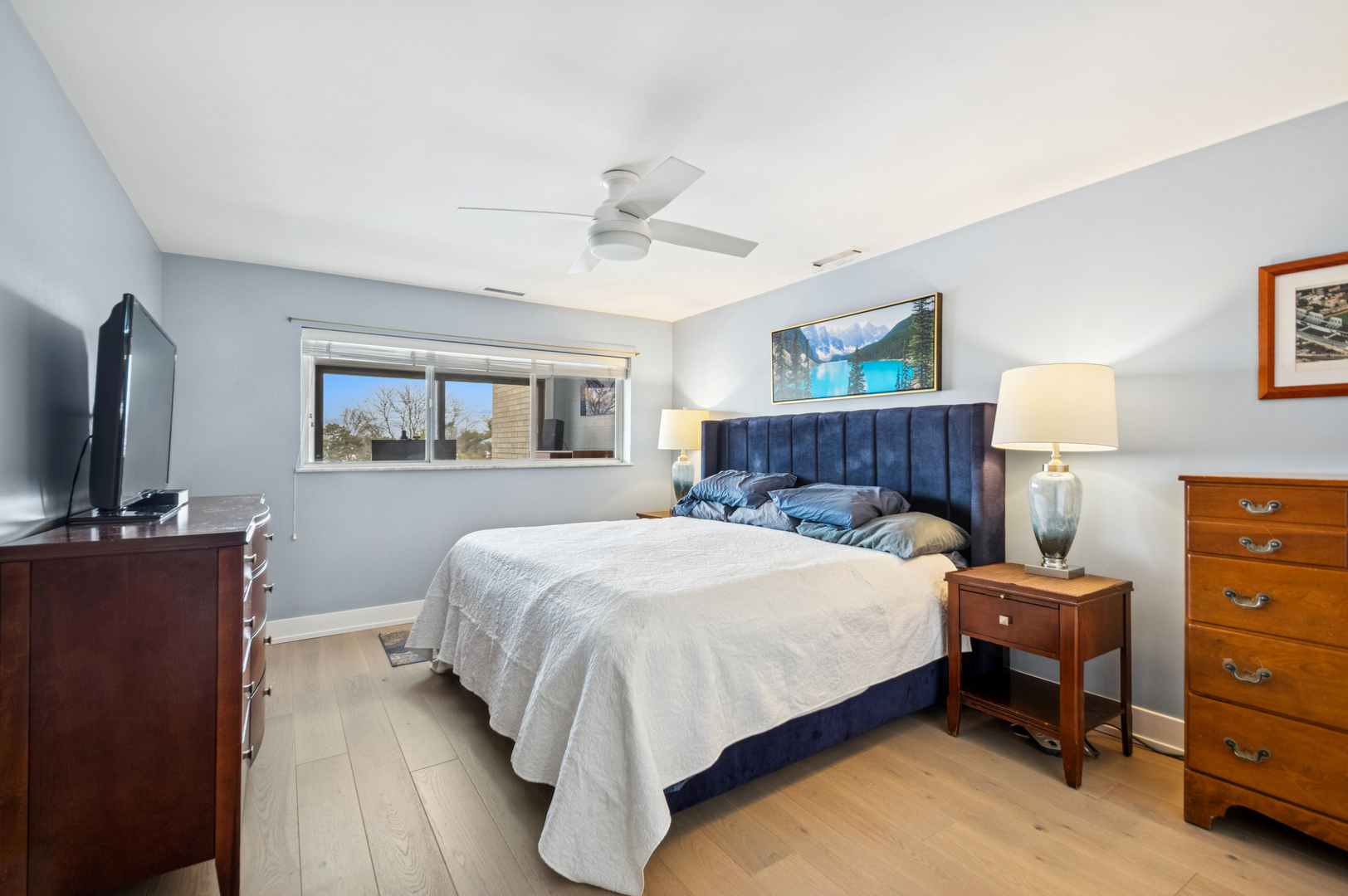 1 North Dee Road, Unit 3G Park Ridge, IL 60068 - Photo 16 of 24 a bedroom with a bed and a flat screen tv