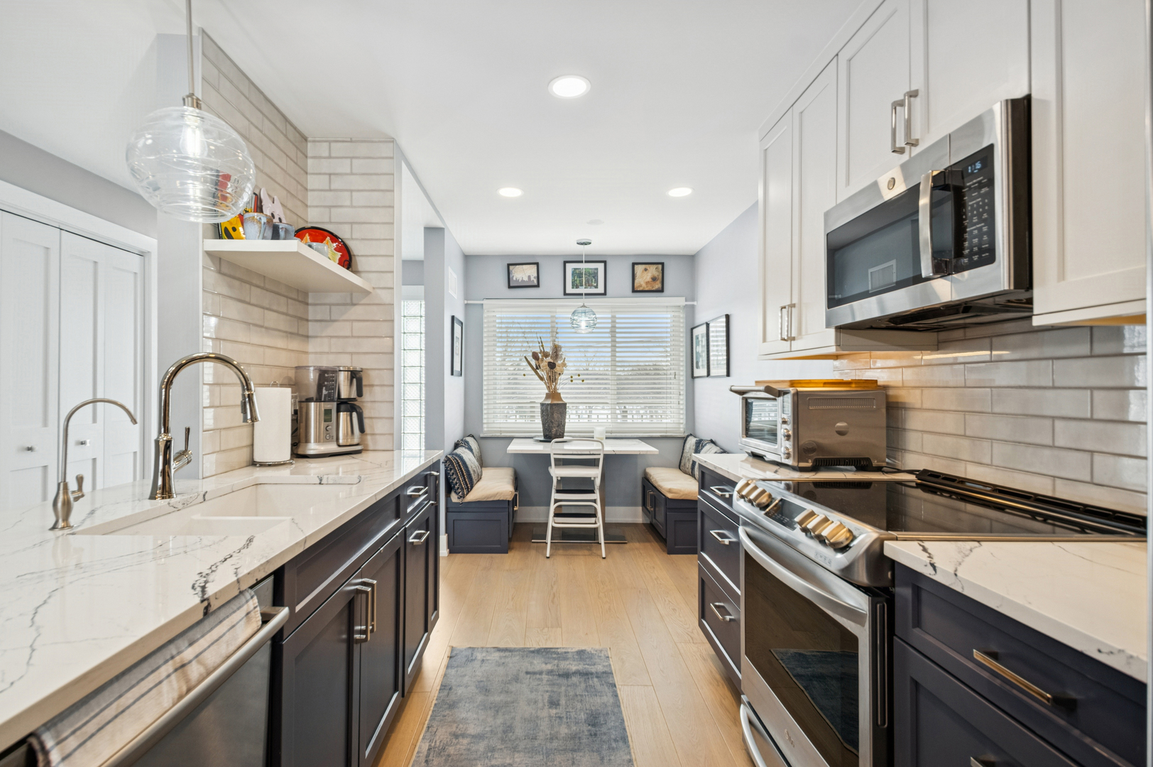 1 North Dee Road, Unit 3G Park Ridge, IL 60068 - Photo 4 of 24 a kitchen with stainless steel appliances a stove sink microwave and cabinets