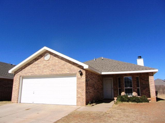 6514 89th Street Lubbock, TX 79424 - Photo 1 of 10 a front view of a house with garden