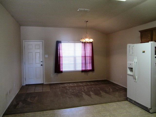 6514 89th Street Lubbock, TX 79424 - Photo 6 of 10 a view of an empty room and window