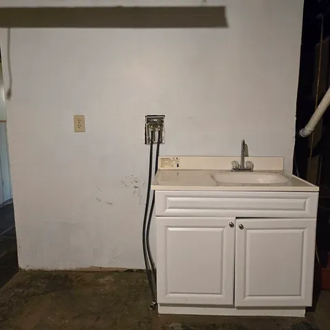 a sink sitting in a bathroom