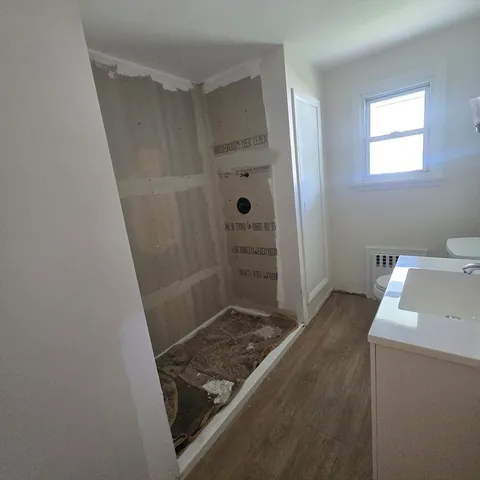 a bathroom with a sink and a shower