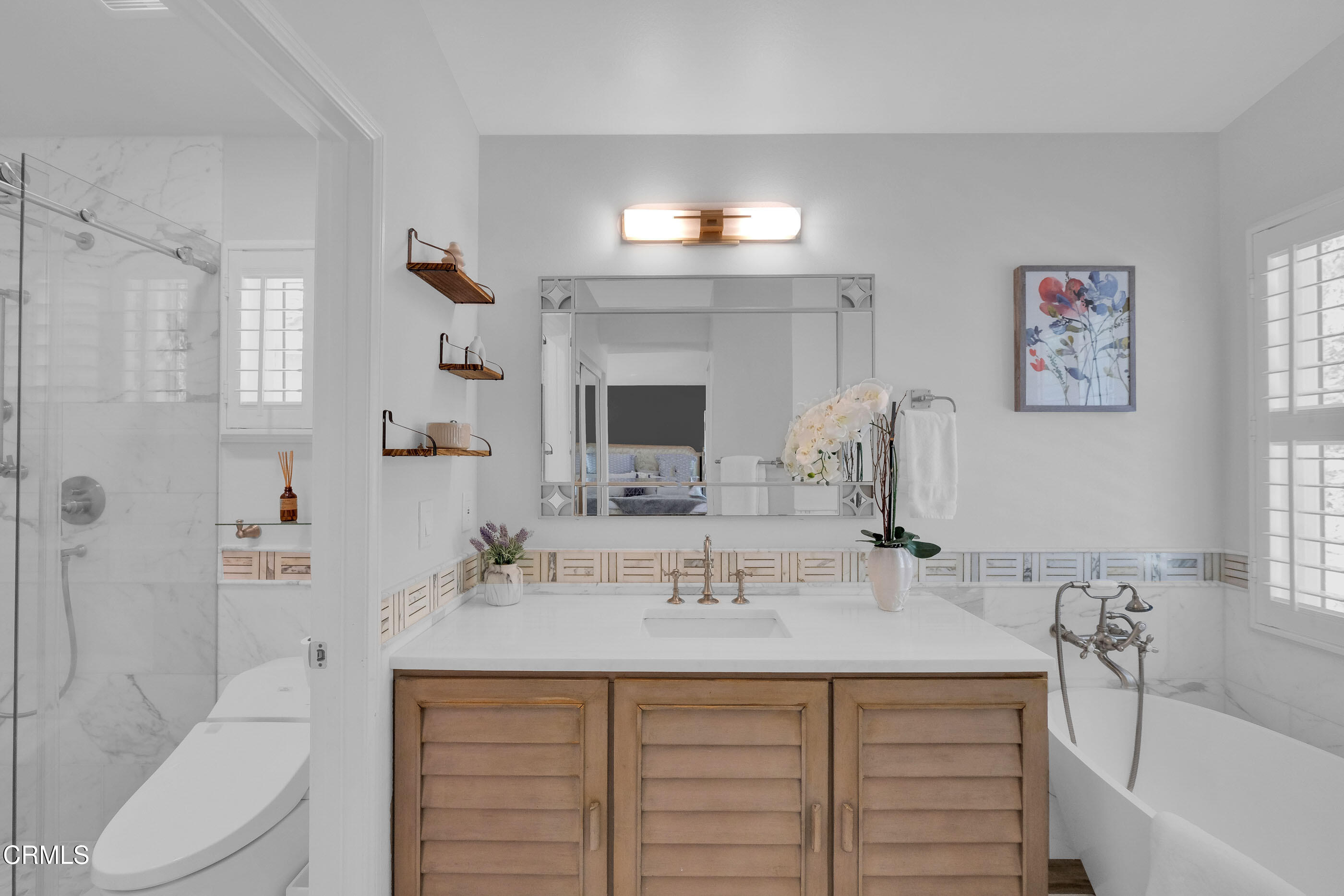 878 Calle La Primavera Glendale, CA 91208 - Photo 18 of 35 a bathroom with a sink double vanity and a bathtub