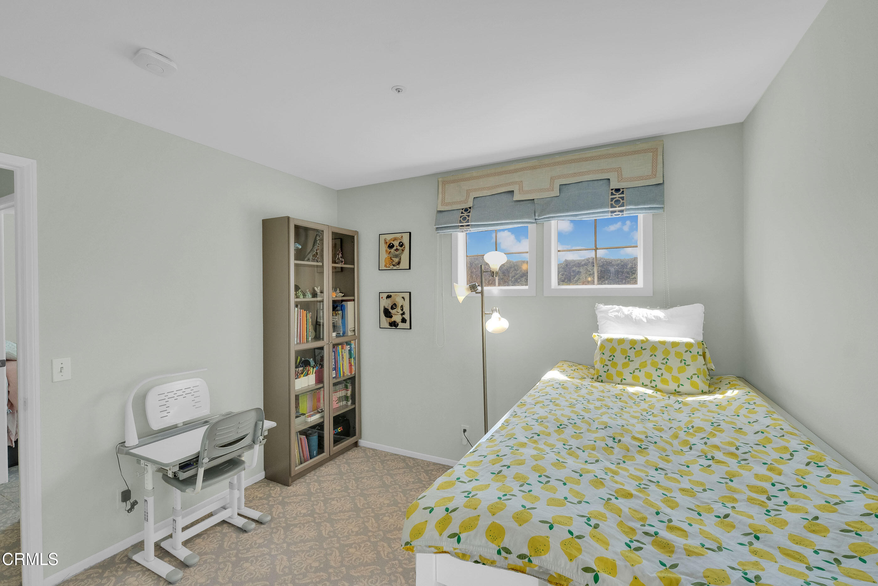 878 Calle La Primavera Glendale, CA 91208 - Photo 23 of 35 a bedroom with a bed and cabinets