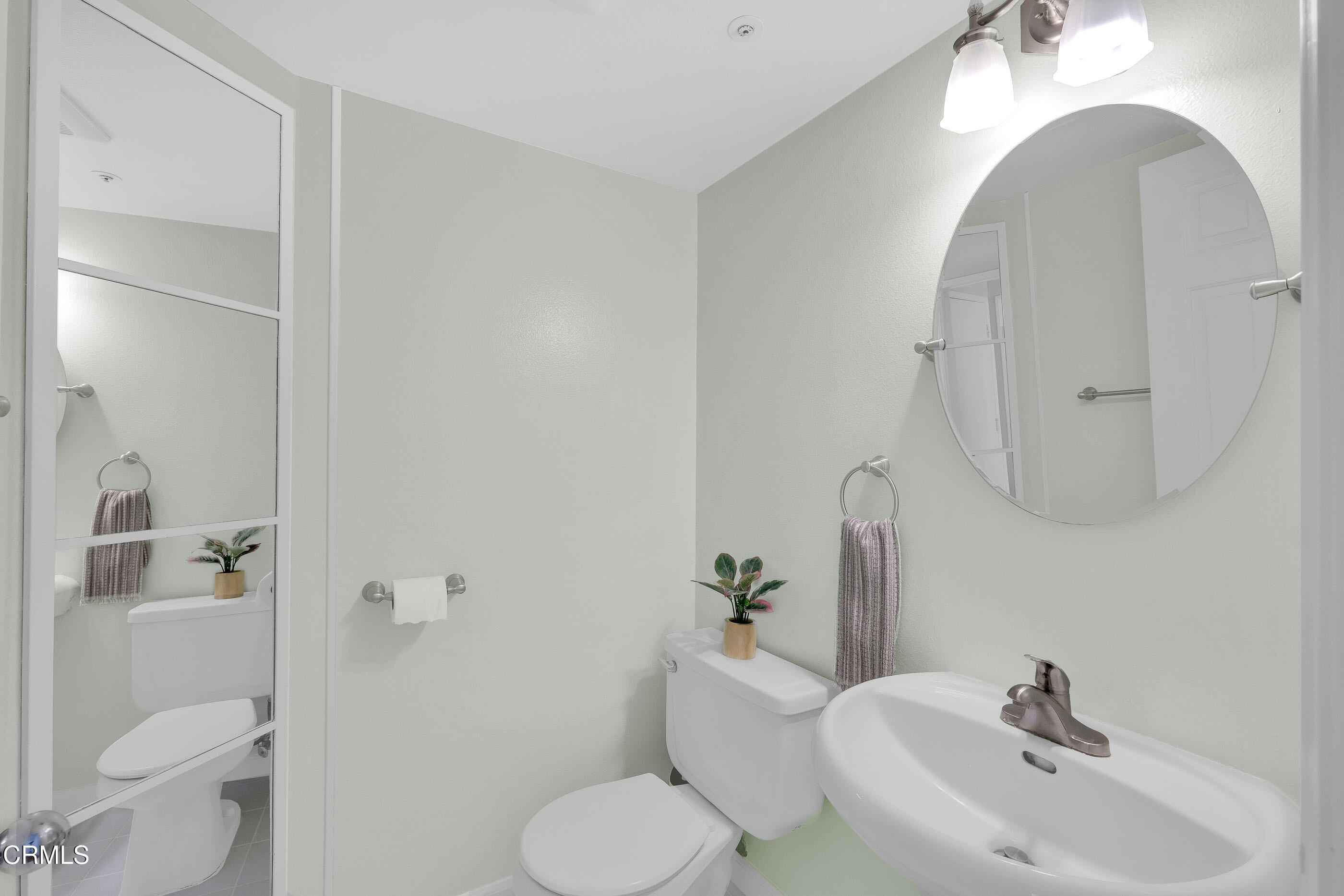 878 Calle La Primavera Glendale, CA 91208 - Photo 24 of 35 a bathroom with a toilet sink and mirror