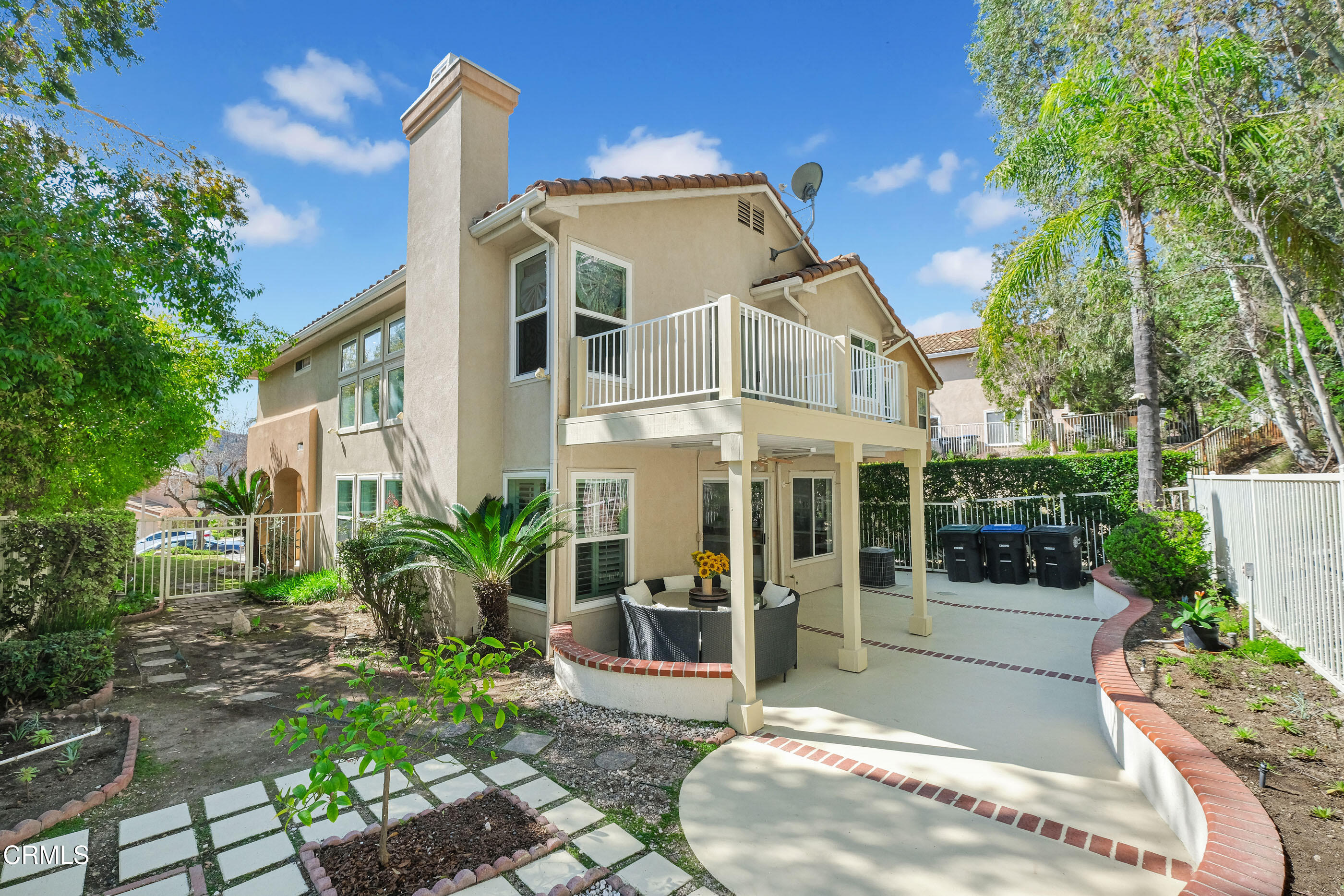 878 Calle La Primavera Glendale, CA 91208 - Photo 29 of 35 a view of a white house with large windows and plants