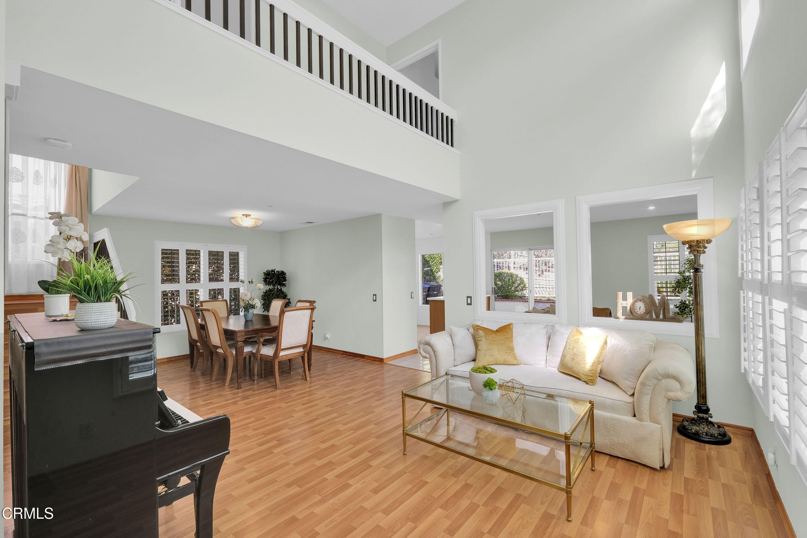 878 Calle La Primavera Glendale, CA 91208 - Photo 4 of 35 a living room with furniture and a wooden floor