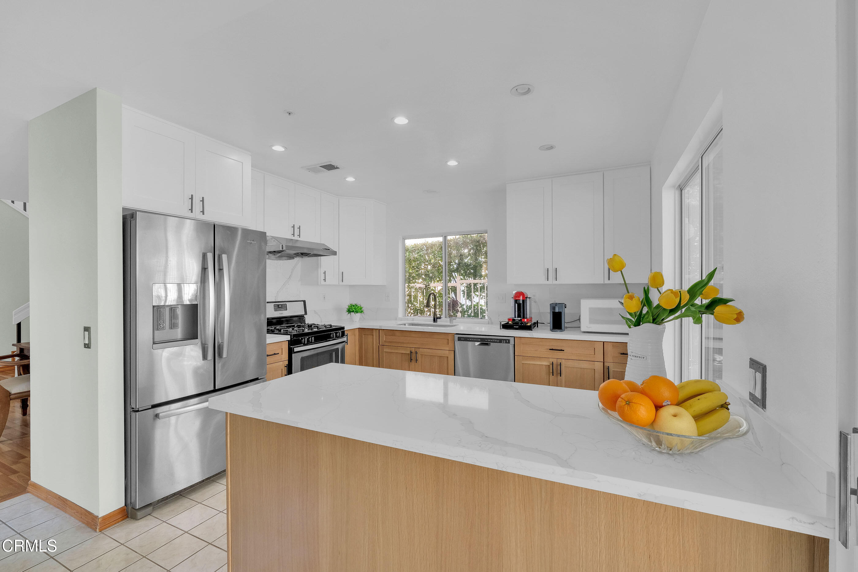 878 Calle La Primavera Glendale, CA 91208 - Photo 10 of 35 a kitchen with stainless steel appliances a refrigerator and a sink