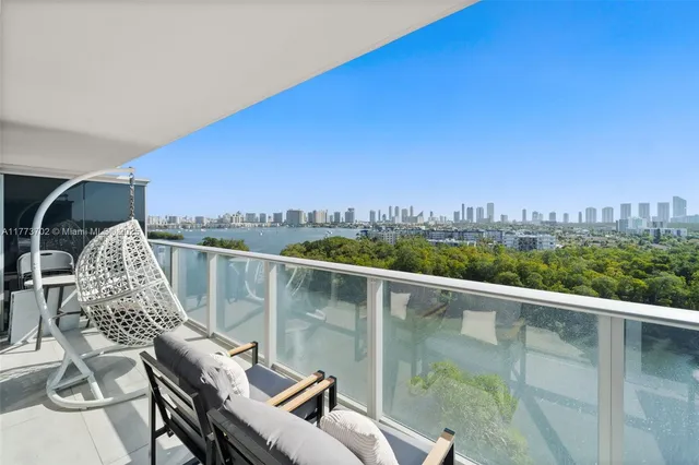 a view of a balcony with chairs