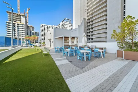 a view of a swimming pool with an outdoor space and seating area