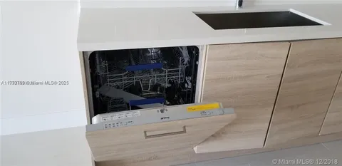 a large bedroom with a bed and a window