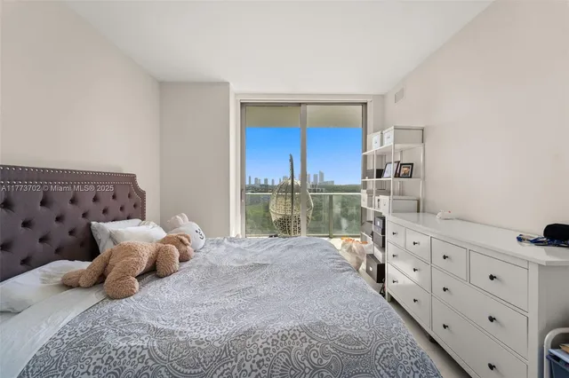 a bedroom with a bed a book shelf and a window