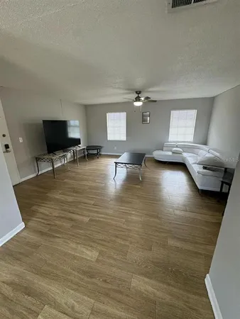 a view of livingroom with furniture and window