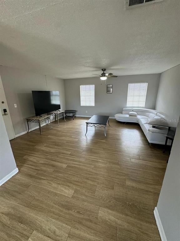 1649 West Oak Ridge Road, Unit 1649C Orlando, FL 32809 - Photo 6 of 8 a view of livingroom with furniture and window