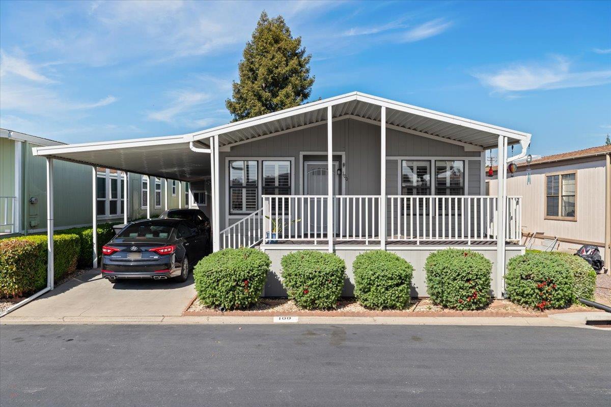 1500 Held Drive, Unit 100 Modesto, CA 95355 - Photo 11 of 59 a front view of a house with garden