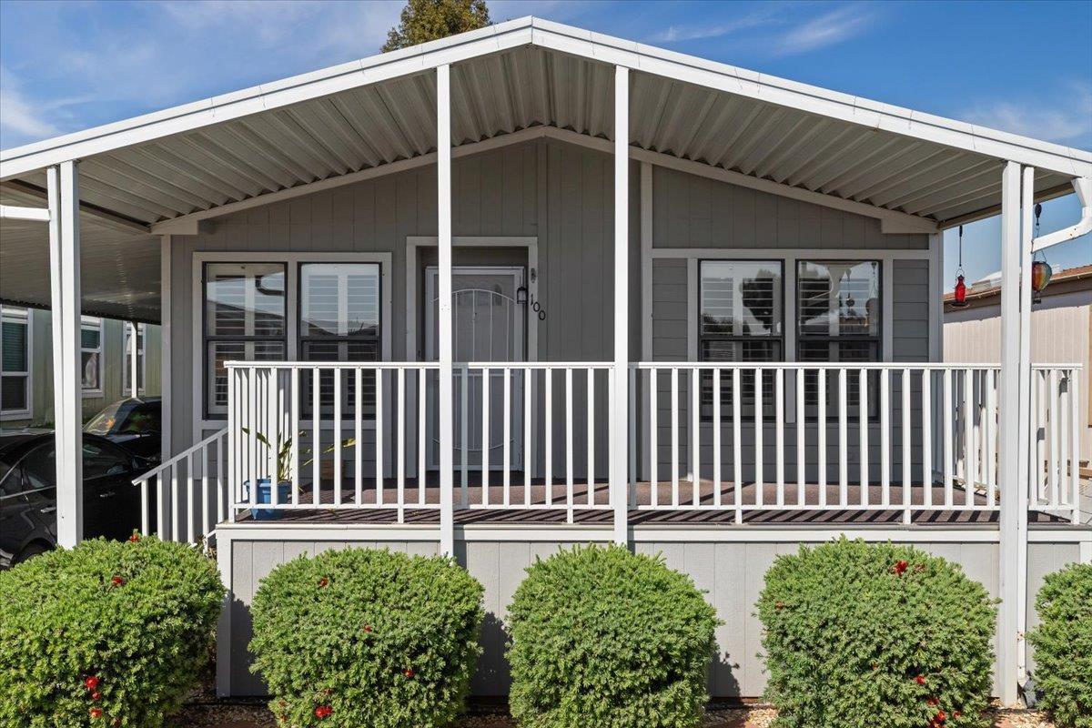 1500 Held Drive, Unit 100 Modesto, CA 95355 - Photo 14 of 59 a view of a house with a small yard