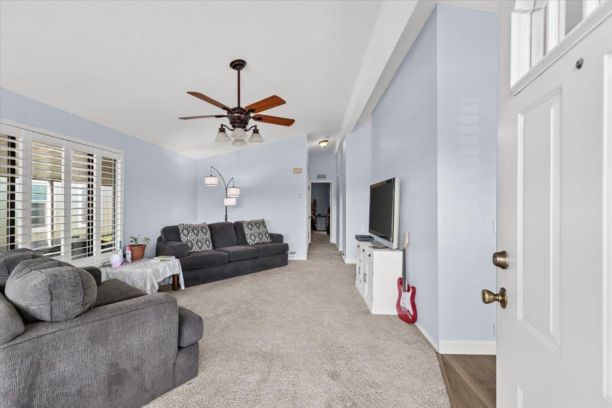 1500 Held Drive, Unit 100 Modesto, CA 95355 - Photo 16 of 59 a living room with furniture and a flat screen tv