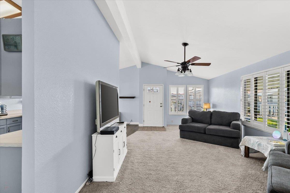1500 Held Drive, Unit 100 Modesto, CA 95355 - Photo 19 of 59 a living room with furniture and a flat screen tv