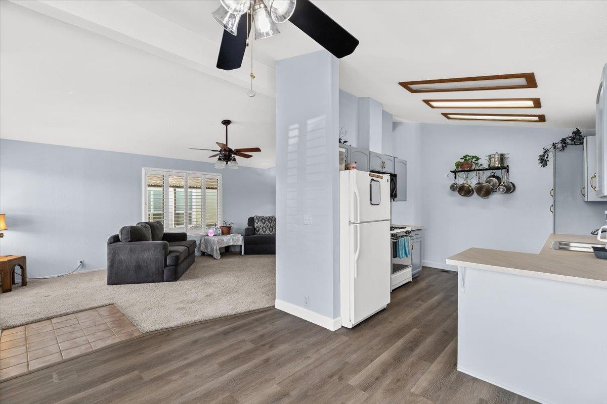 1500 Held Drive, Unit 100 Modesto, CA 95355 - Photo 23 of 59 a living room with furniture and a chandelier