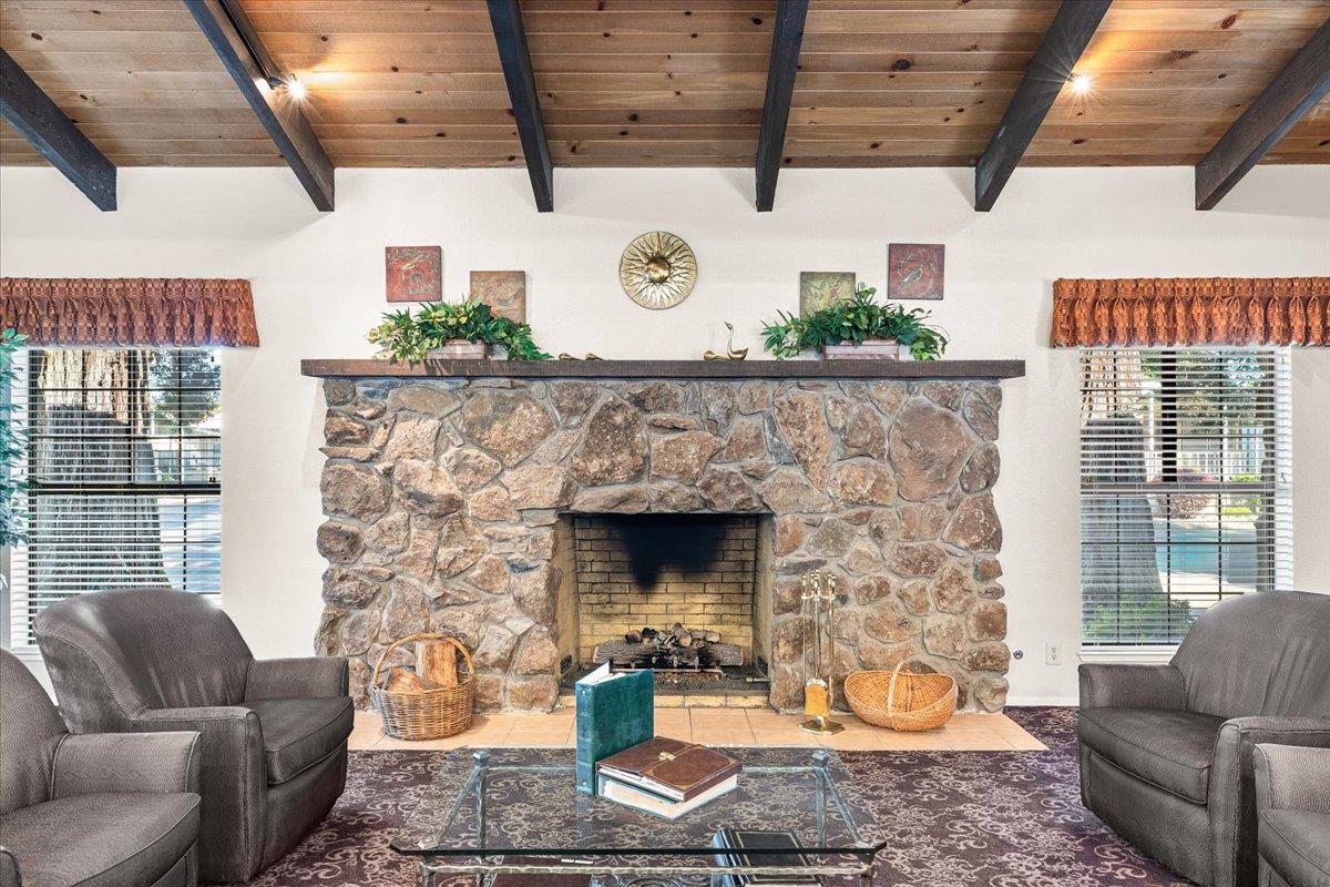 1500 Held Drive, Unit 100 Modesto, CA 95355 - Photo 37 of 59 a living room with furniture and a fireplace