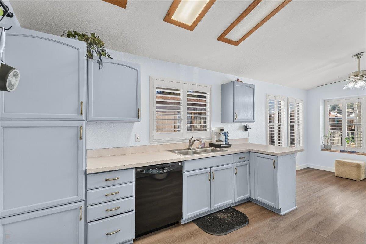 1500 Held Drive, Unit 100 Modesto, CA 95355 - Photo 4 of 59 a kitchen with white cabinets and sink