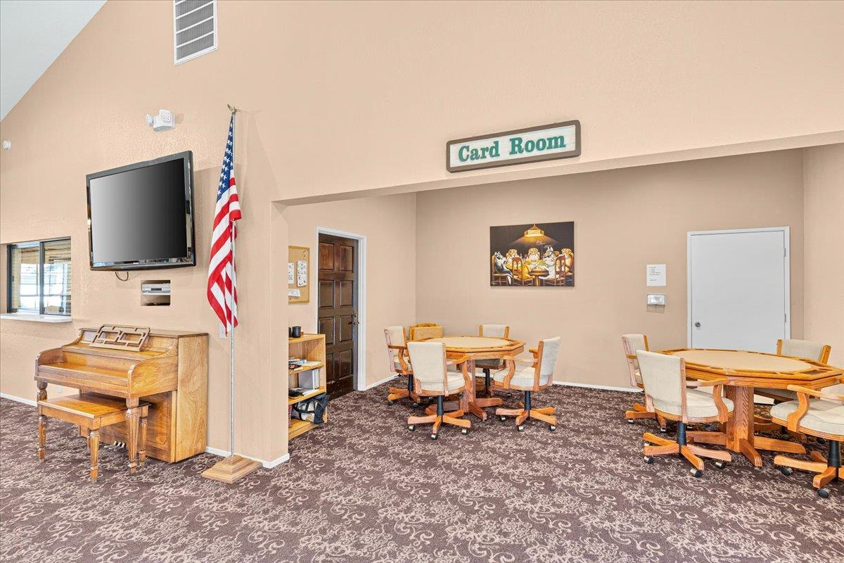 1500 Held Drive, Unit 100 Modesto, CA 95355 - Photo 44 of 59 a living room with furniture a flat screen tv and a window