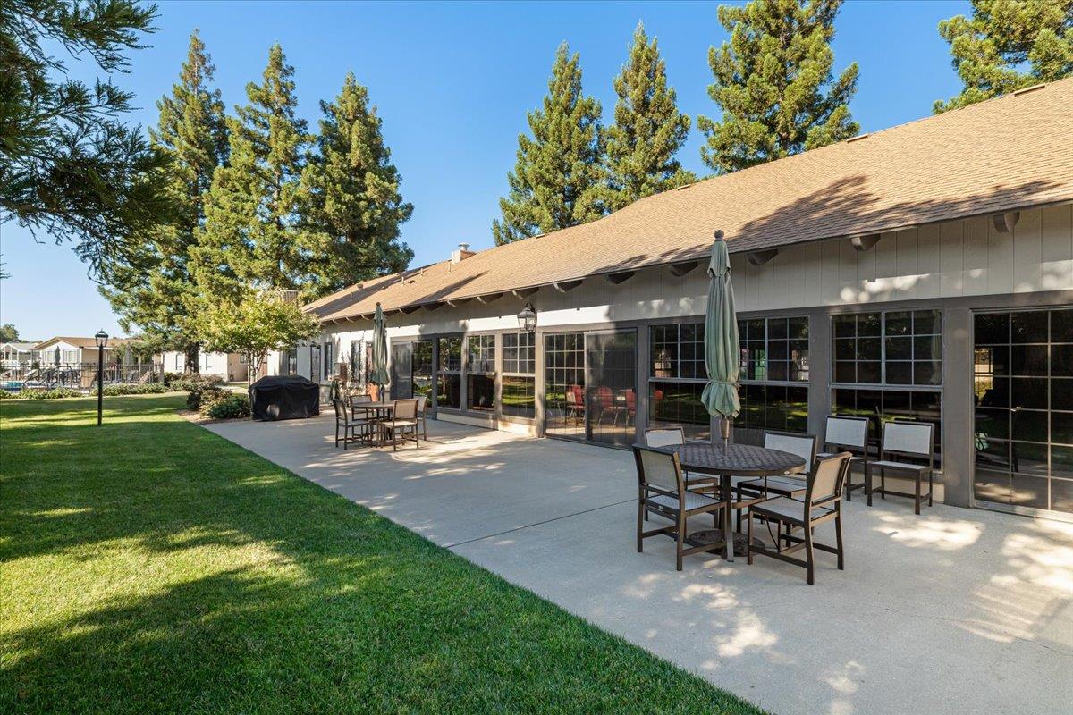 1500 Held Drive, Unit 100 Modesto, CA 95355 - Photo 52 of 59 a view of a house with backyard sitting area and garden