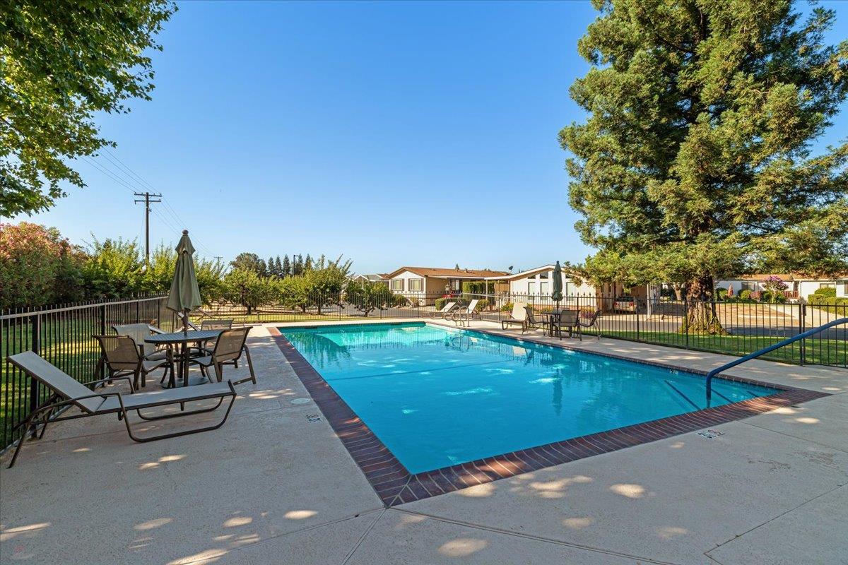 1500 Held Drive, Unit 100 Modesto, CA 95355 - Photo 55 of 59 a view of a swimming pool with lounge chairs
