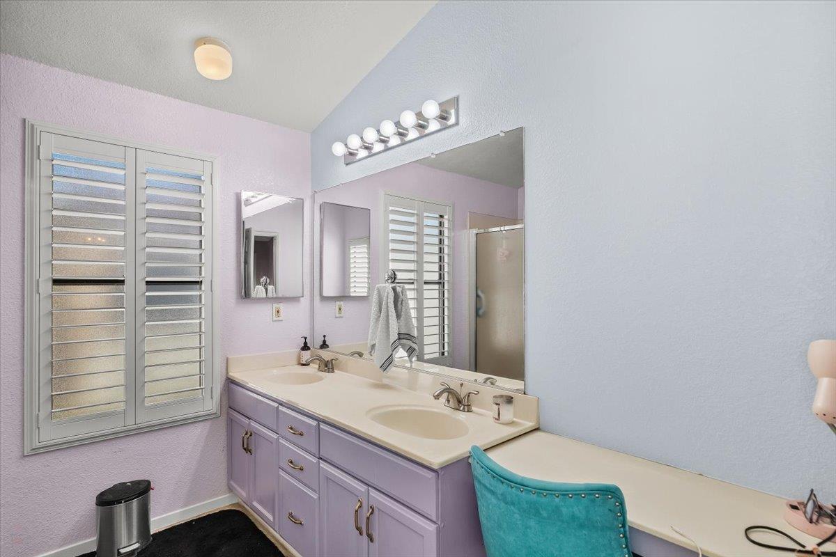 1500 Held Drive, Unit 100 Modesto, CA 95355 - Photo 8 of 59 a bathroom with a sink a toilet and mirror