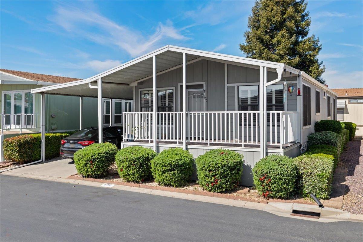 1500 Held Drive, Unit 100 Modesto, CA 95355 - Photo 10 of 59 a front view of a house having yard