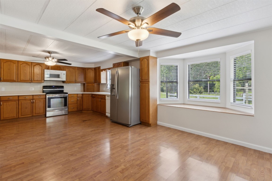 2889 Santa Fe Trail Hilliard, FL 32046 - Photo 17 of 49 a view of kitchen with furniture wooden floor and window