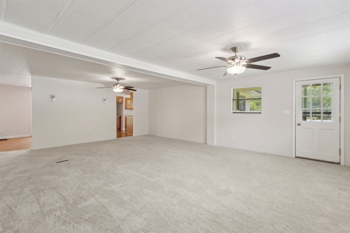 2889 Santa Fe Trail Hilliard, FL 32046 - Photo 20 of 49 a view of an empty room with a ceiling fan