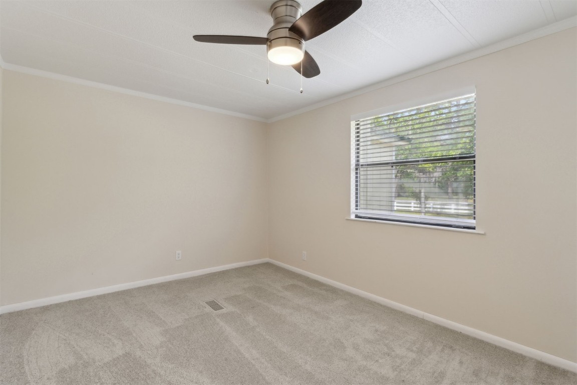 2889 Santa Fe Trail Hilliard, FL 32046 - Photo 25 of 49 an empty room with a window and ceiling fan