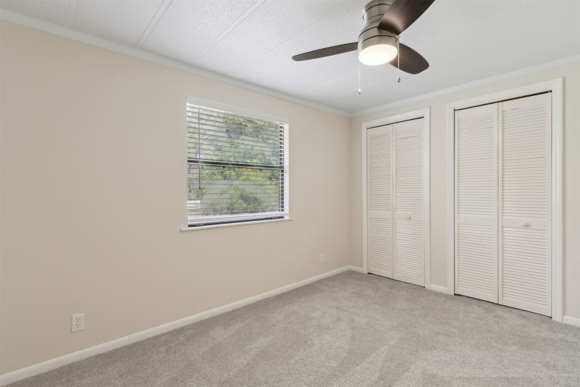 2889 Santa Fe Trail Hilliard, FL 32046 - Photo 26 of 49 an empty room with windows and fan