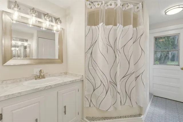 a bathroom with a sink and mirror