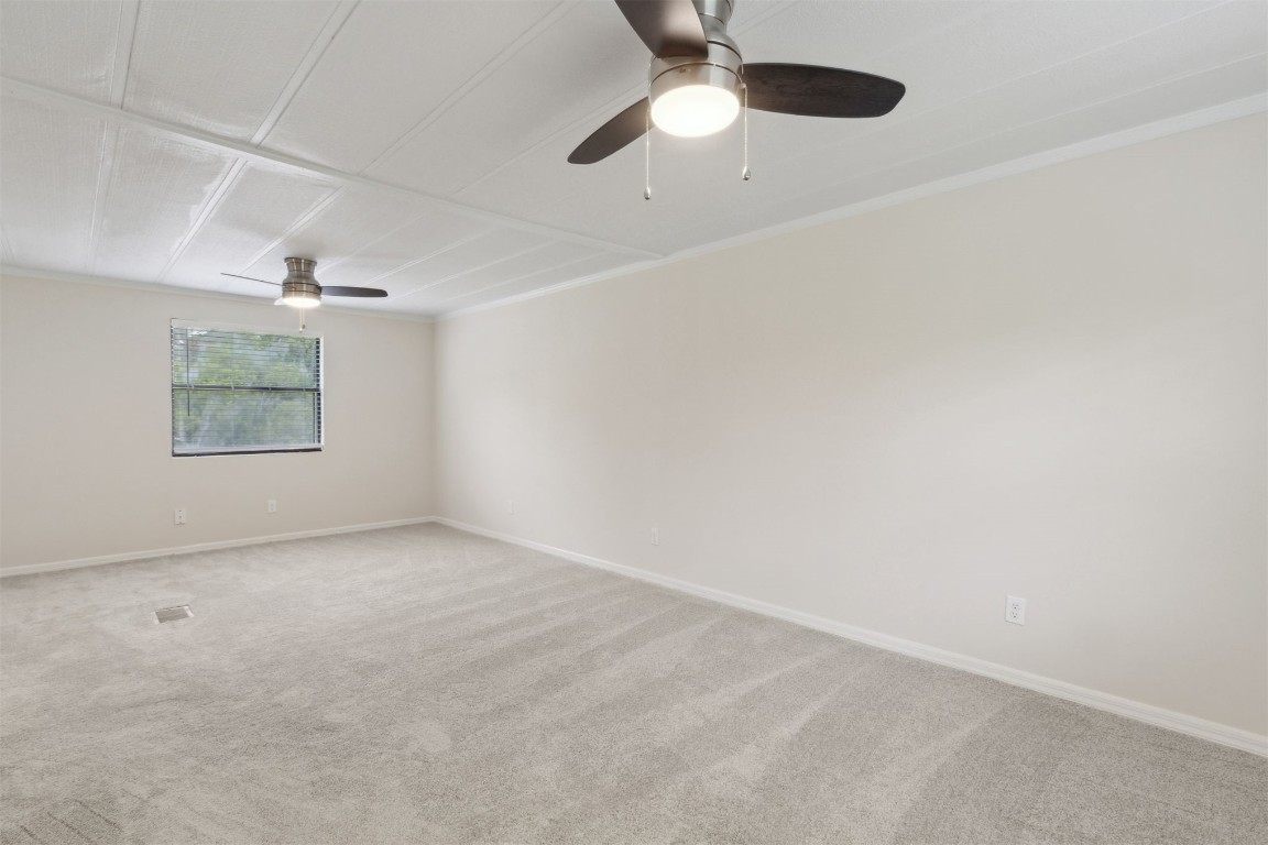 2889 Santa Fe Trail Hilliard, FL 32046 - Photo 32 of 49 en empty room with windows and ceiling fan view