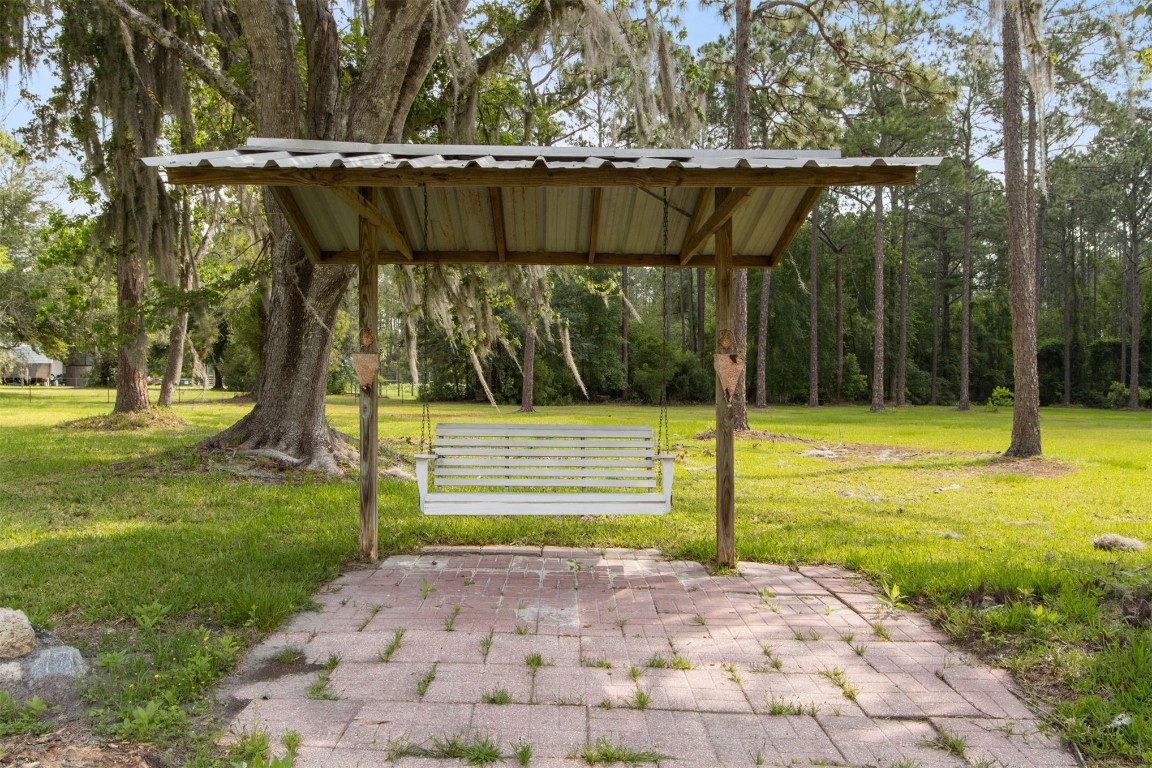2889 Santa Fe Trail Hilliard, FL 32046 - Photo 44 of 49 a view of a backyard with swimming pool