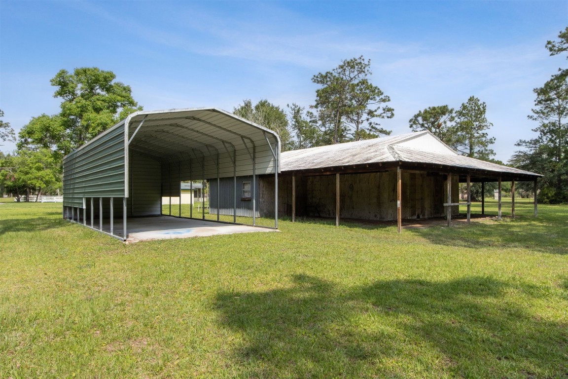 2889 Santa Fe Trail Hilliard, FL 32046 - Photo 45 of 49 a front view of a house with a yard
