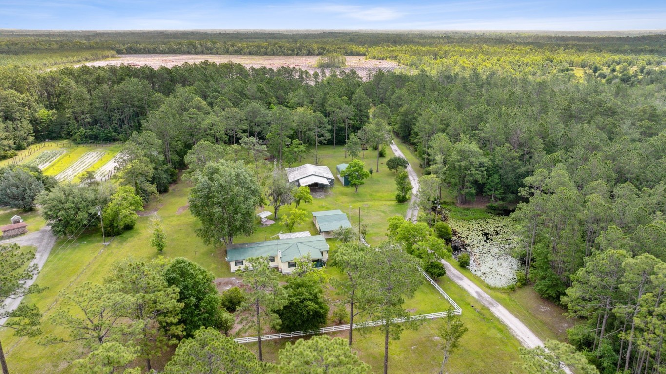 2889 Santa Fe Trail Hilliard, FL 32046 - Photo 48 of 49 a view of a lake with a yard